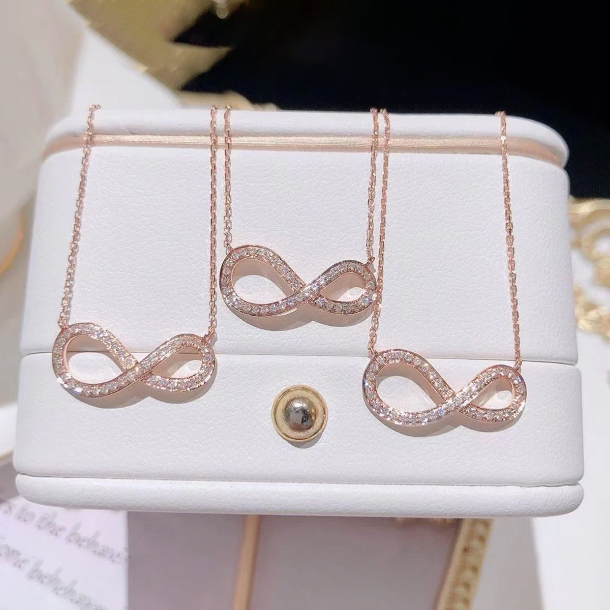 Scentorya Rose Plated Studded With Cubic  Zirconia In Infinity Shape Chain Pendant